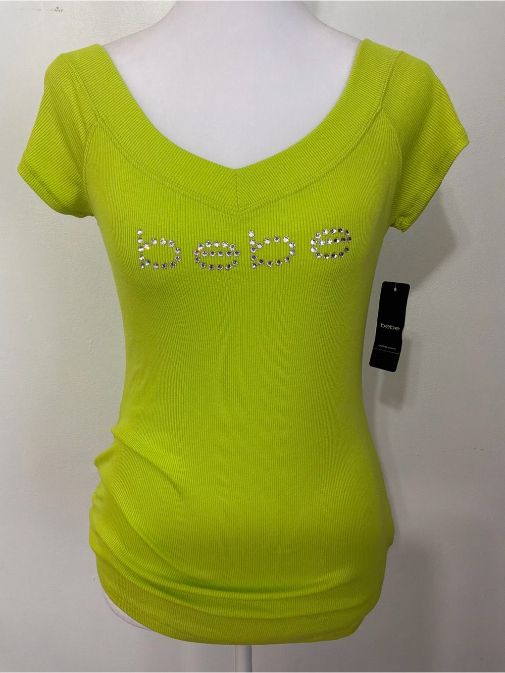 NWT Y2K Bebe logo t-shirt features a vibrant electric green ribbed fabric